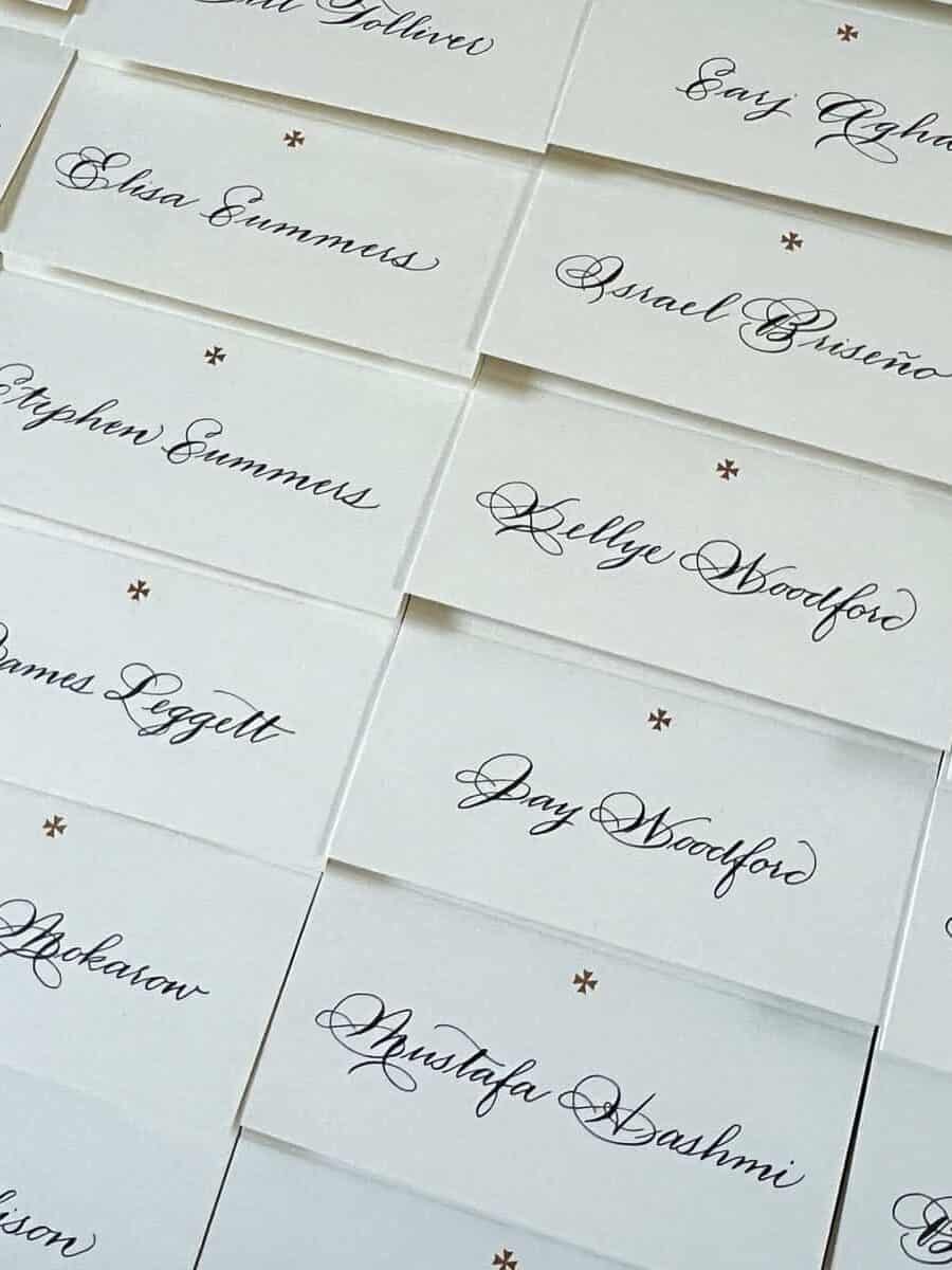 many place cards with calligraphy